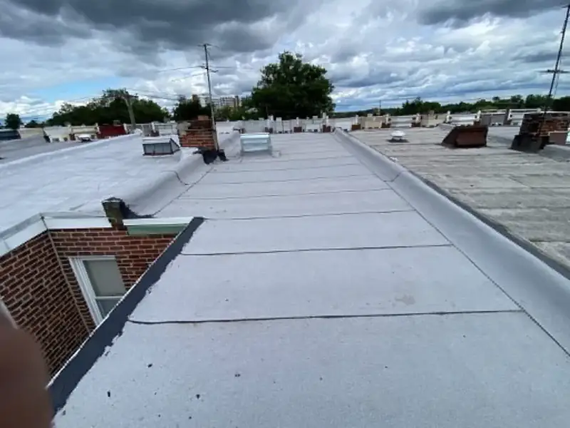 White TPO flat roof membrane completed Haines City FL — reflective flat roofing commercial Polk County